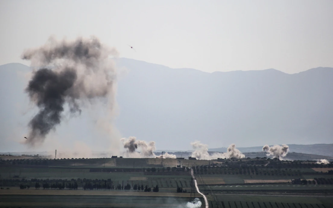 Smoke billows following reported shelling around the village of Al-Muntar on the southern edges of the rebel-held Idlib province on May 12, 2019. (AFP)