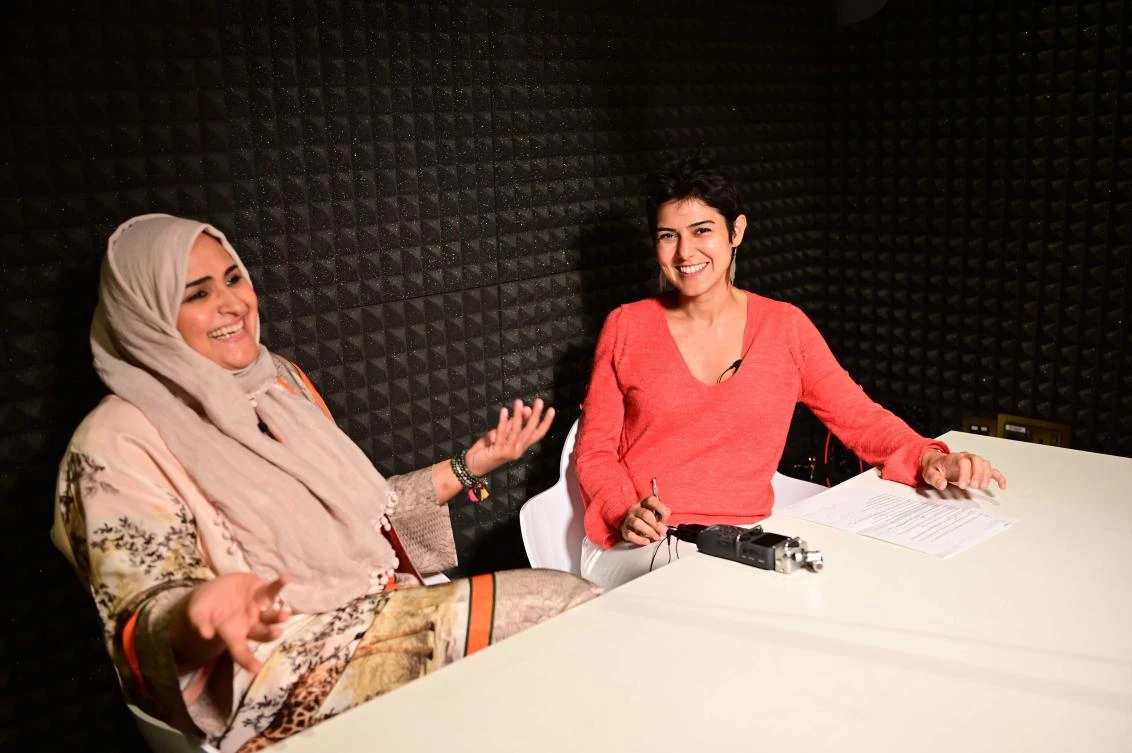 Rana Nawas (R), the producer of the English-language series ‘When Women Win,’ hosts Saudi Arabian comedian and Hatoon Kadi during a podcast recording session in Dubai. AFP