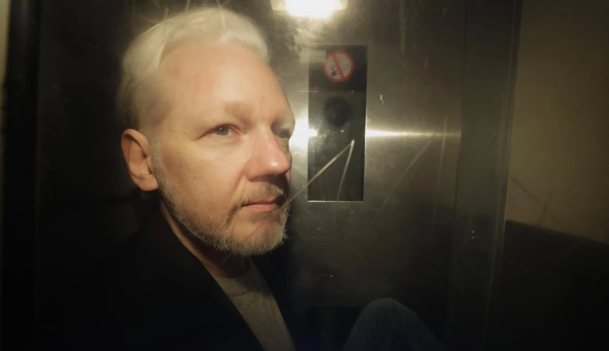 WikiLeaks founder Julian Assange being taken from court, where he appeared on charges of jumping British bail seven years ago, in London, Wednesday May 1, 2019. (AP)