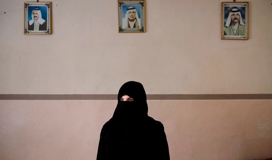 In this April 14, 2019 photo, Khadija Abd poses for a portrait in her family's house in Mosul, Iraq. On a chilly January evening, the Abd family had just finished supper at their farm when the two men with guns burst into the room. They said they were from the Iraqi army. In fact, they were Daesh militants who had come down from the surrounding mountains into Badoush with one thing on their mind: Revenge. (AP)
