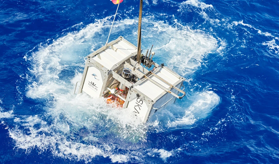 The Skaff lander floats next to the research vessel DSSV Pressure Drop above the Pacific Oceans's Mariana Trench in an undated photo released by the Discovery Channel May 13, 2019. (REUTERS)