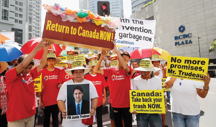 Protesters stage a rallly outside the Canadian Embassy in Manila demanding Canada take back tons of rubbish it had sent to the Philippines. (File/Shutterstock)