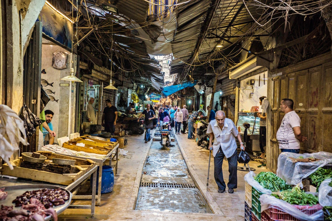 Shoppers in the old souk in Tripoli, Lebanon. The country must introduce economic reforms and a harsh budget to secure loans and eventually reduce its indebtedness. (Shutterstock)