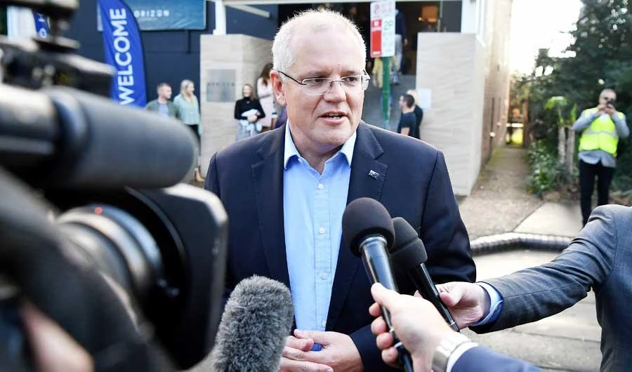 Australian Prime Minister Scott Morrison speaks to the media as he arrives at the Horizon Church in Sutherland in Sydney, Australia, May 19, 2019. (REUTERS)