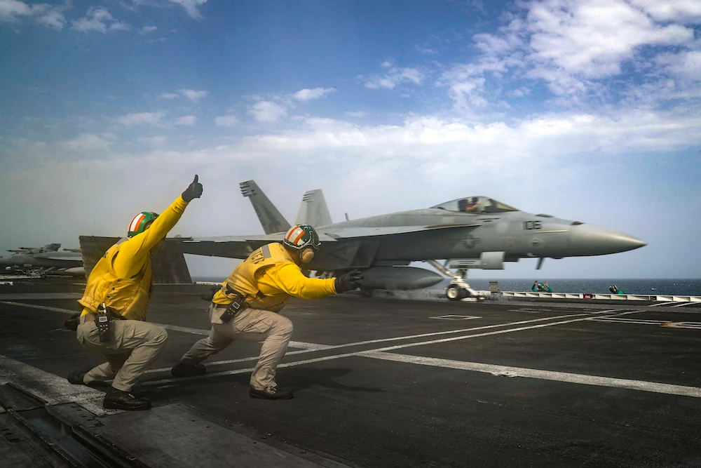 The USS Abraham Lincoln aircraft carrier in the Arabian Sea last week. Jeremy Hunt said Iranians should think very carefully about their actions. (AFP/File)