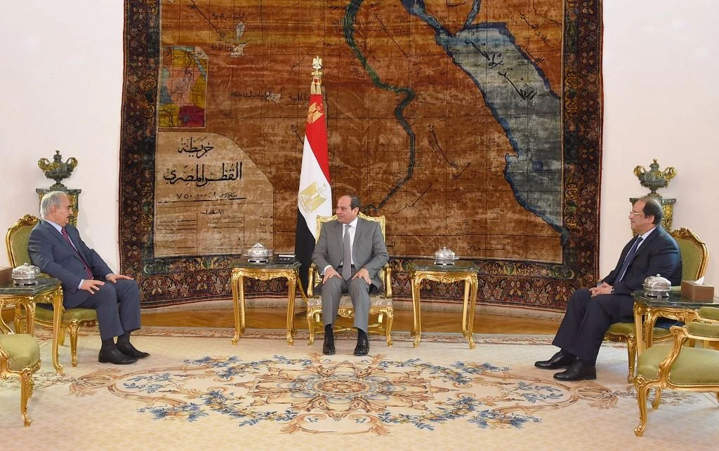 Khalifa Haftar, left, is closely allied with Abdel-Fattah El-Sisi, center. (AFP/File)