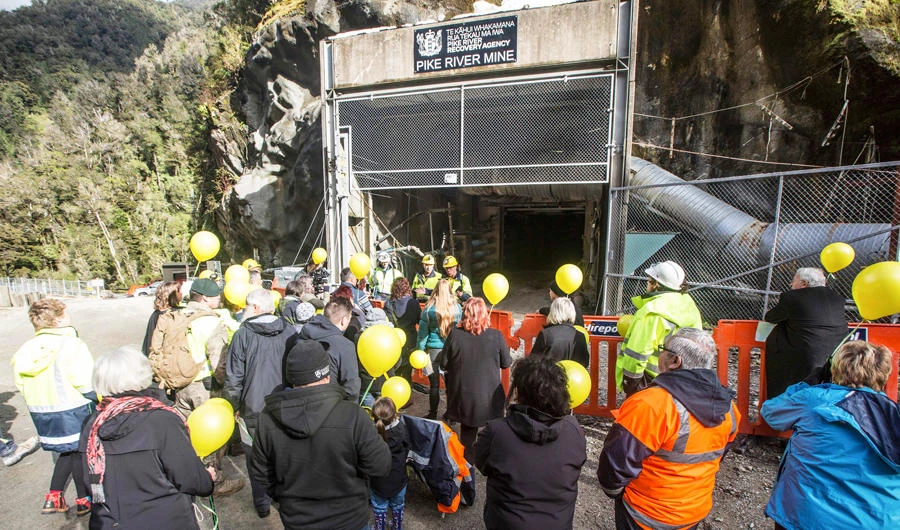 In this image released by the Pike River Recovery Agency, families gather at the entrance of the Pike River Mine, near Greymouth on the West Coast of New Zealand, Tuesday, May 21, 2019. (AP)