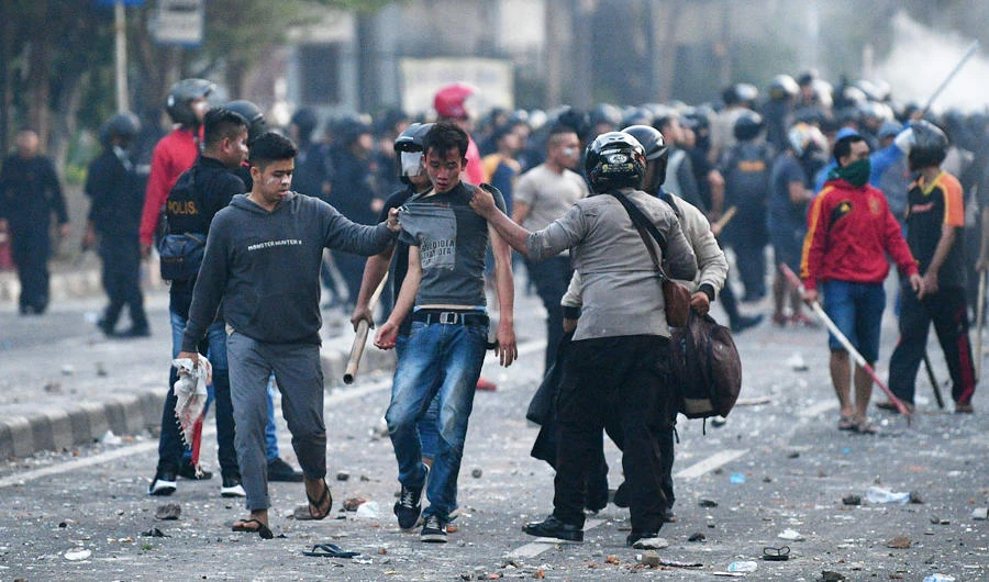 Police detain protesters after clashes in Jakarta, Indonesia, early May 22, 2019 in this photo taken by Antara Foto. (Reuters)
