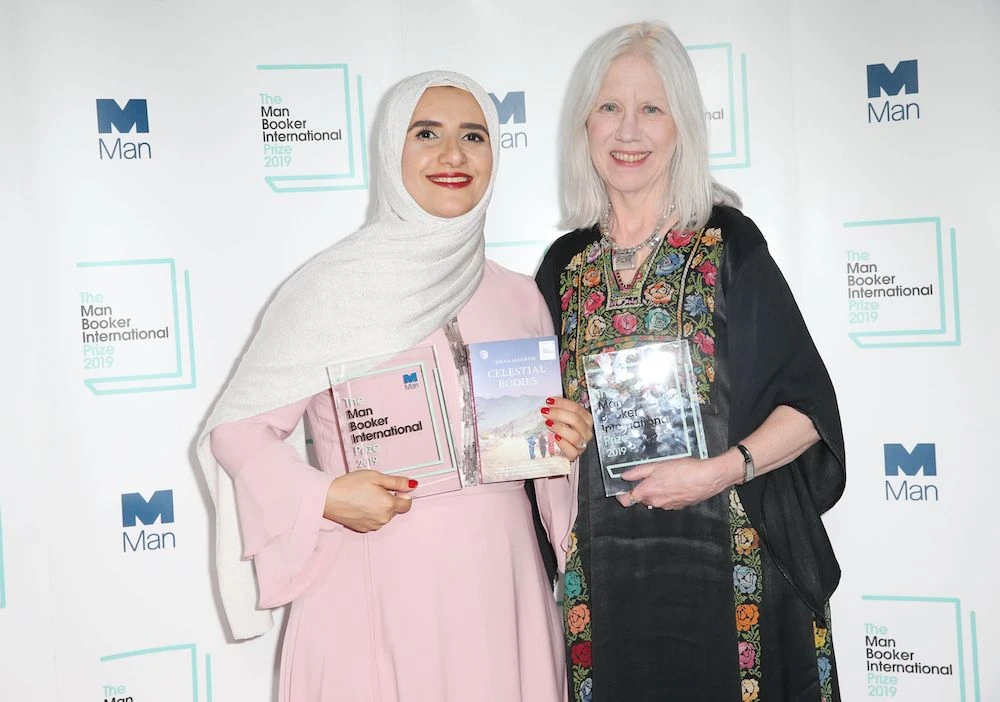 Arabic author Jokha Alharthi (L) and translator Marilyn Booth pose after winning the Man Booker International Prize for the book ‘Celestial Bodies’ in London on May 21, 2019. (AFP)