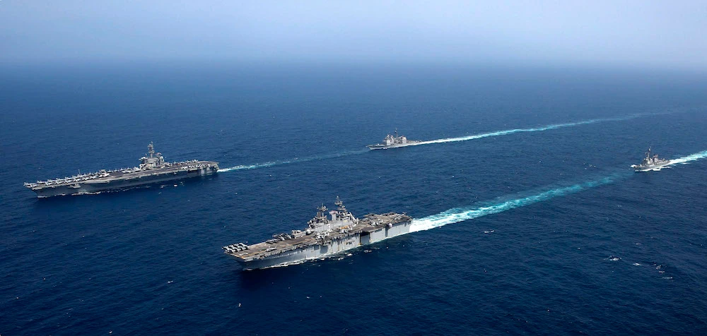 Abraham Lincoln Carrier Strike Group (ABECSG) and Kearsarge Amphibious Ready Group (KSGARG) conduct joint operations in the U.S. 5th Fleet area of operations in the Arabian Gulf. (US Navy)