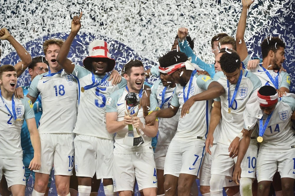 England's players celebrate with the Under-20 World Cup in 2017. Saudi Arabia, the UAE and Bahrain hope to host the event in 2021. (AFP)