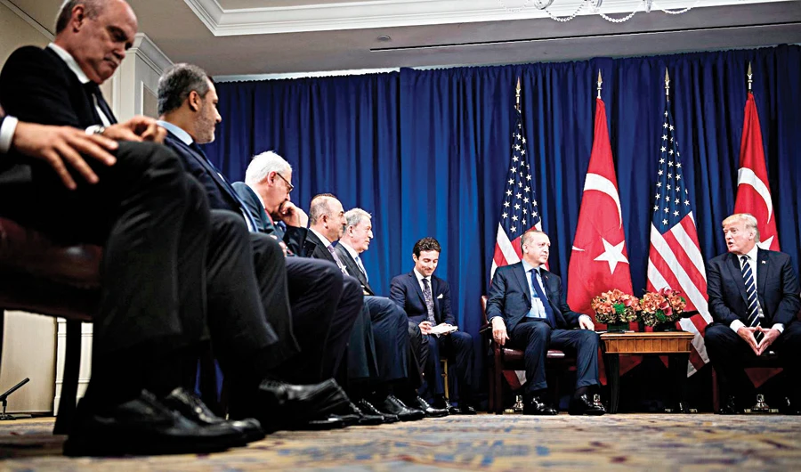 Turkish President Recep Tayyip Erdogan and US President Donald Trump speak at a meeting during the UN General Assembly in New York. (AFP/File)
