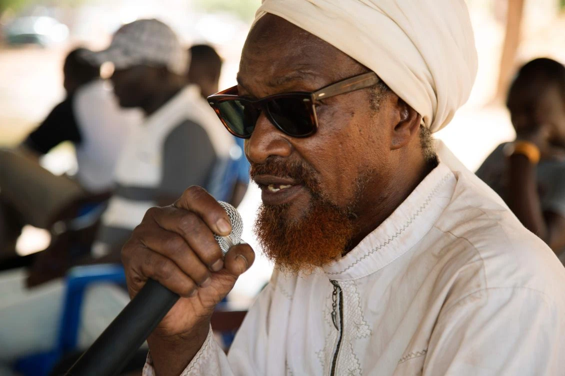 Moustafa Djobe speaks on May 23, 2019 to members of a group called 'Sigida Lakana' or 'Protection of our environment' in the Bambara language, while they take part in a 48 hour sit-in in front of the new headquarters of the G5 Sahel, which was previously based in Sevare, Mali, until it was attacked last year. (AFP)