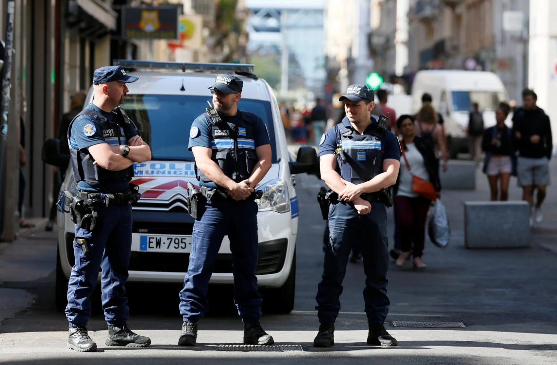 Police patrol the streets during the manhunt of a suspected suitcase bomber in central Lyon, France, May 25, 2019. (Reuters)