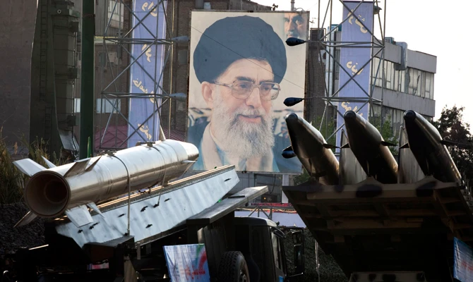 In this file photo, Iranian-made missiles are seen next to a portrait of Supreme Leader Ayatollah Ali Khamenei at a war exhibition held by Iran's revolutionary guard at Baharestan square near the Iranian Parliament. (Reuters)