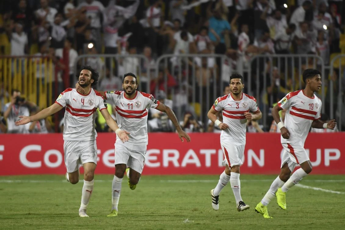 Zamalek’s Mahmoud Alaa, left, after scoring against Morocco’s RSB Berkane during the second leg of the CAF Confederation Cup final at Borg El Arab Stadium near Alexandria. (AFP)