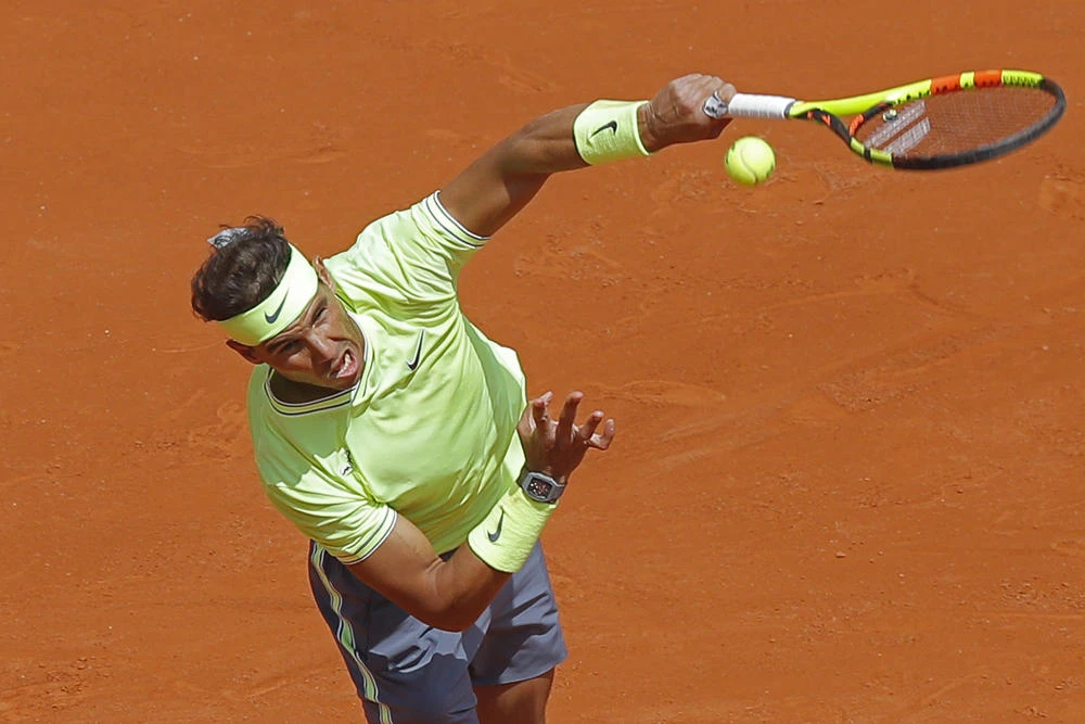 Spain's Rafael Nadal serves against Germany's Yannick Hanfmann during their first round match of the French Open tennis tournament at the Roland Garros stadium in Paris, Monday, May 27, 2019. (AP Photo/Michel Euler)