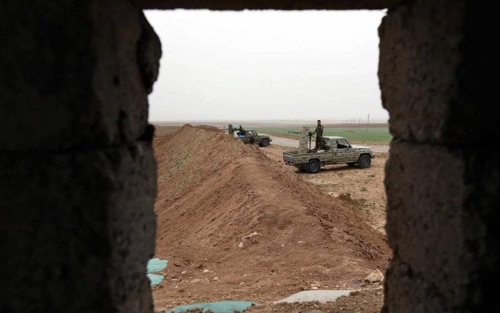 Kurdish fighters hold a position in Faysh Khabur, which lies in Iraq’s Kurdish autonomous region near the three-way border between Iraq, Syria and Turkey in this March 29, 2018 photo. (AFP)