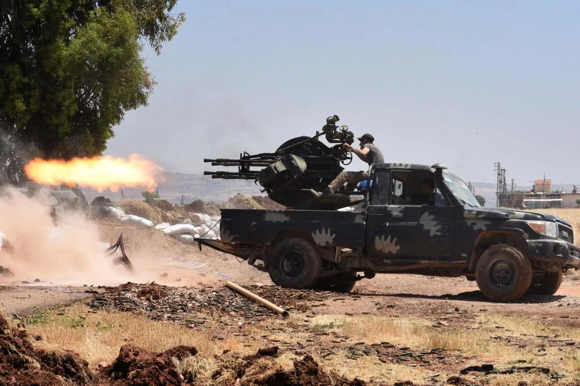 Syrian regime forces clash with extremists near Jabriya in Hama province. At least 21 civilians were killed as Syria’s regime intensified its bombardment of the last extremist stronghold in the country’s northwest. (AFP)