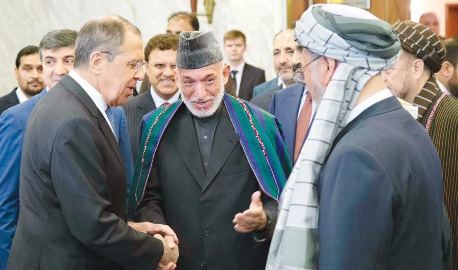 Former Afghan President Hamid Karzai, center, introduces the Taliban delegation to Russian Foreign Minister Sergei Lavrov, left, ahead of their meeting, in Moscow on Tuesday. (AP)