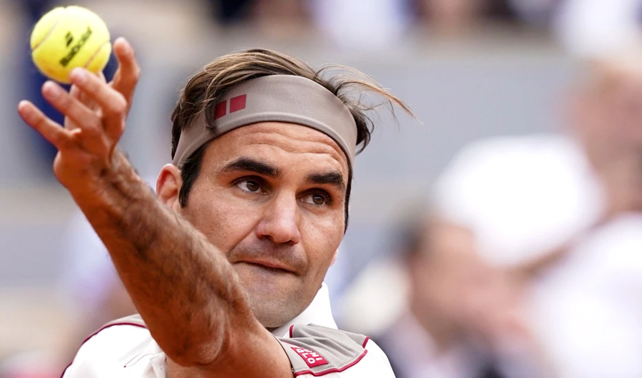 Switzerland's Roger Federer serves a ball to Germany's Oscar Otte during their men's singles second round match on day four of The Roland Garros 2019 French Open tennis tournament in Paris on May 29, 2019. (AFP)