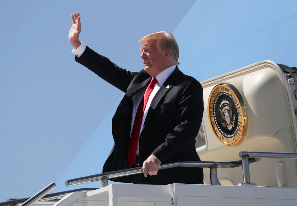 US President Donald Trump waves as he arrives in Colorado to deliver the commencement address at the US Air Force Academy graduation ceremony after landing aboard Air Force One at Peterson Air Force Base in Colorado Springs, Colorado, US, May 30, 2019. (Reuters)