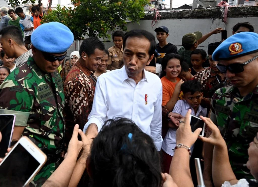 Official results last week confirmed Joko Widodo, center, won 55.5 percent of the vote in the April 17 election. (AFP)