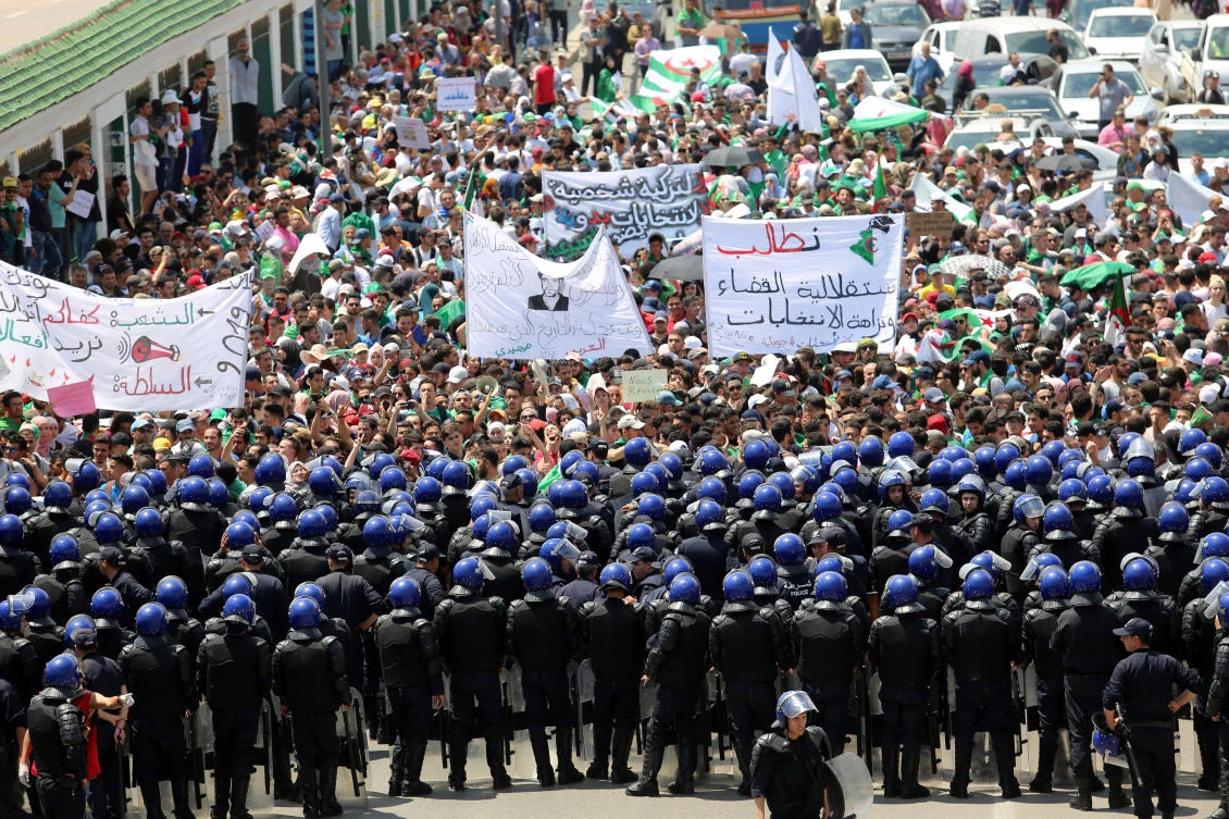 Police members stand guard as students take part in an anti-government protest in Algiers, Algeria May 28, 2019. (Reuters)