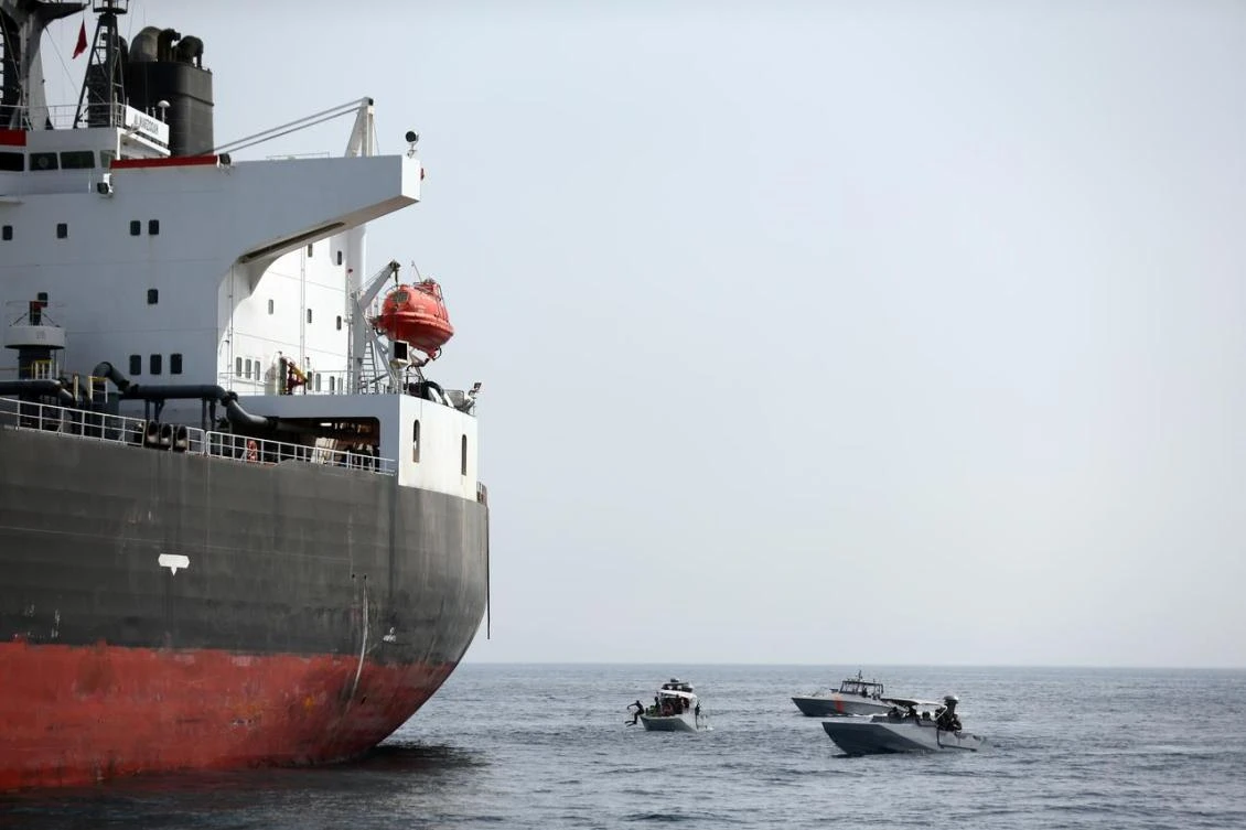 UAE Navy boats patrol near a tanker moored off the Port of Fujairah. (Reuters)