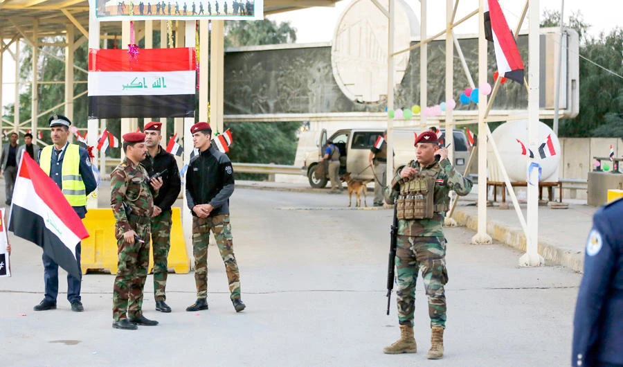 Iraqi security forces stand guard outside the Green Zone, in Baghdad. (AP)