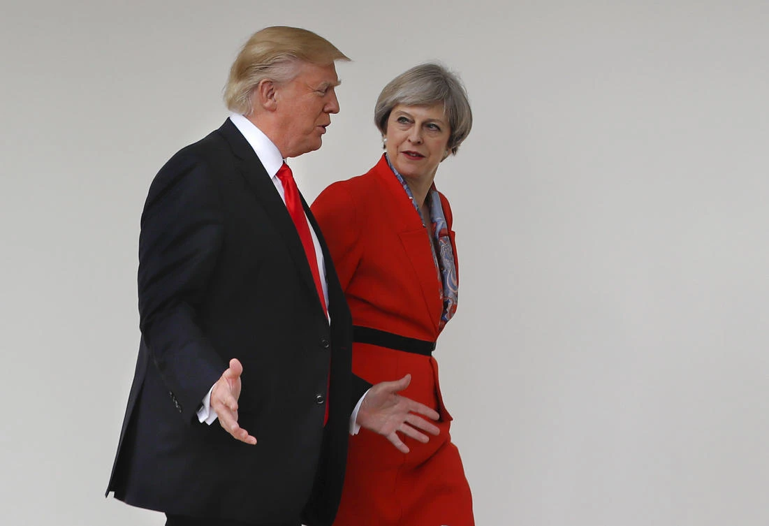 In this file photo from Jan. 27 2017, President Donald Trump and British Prime Minister Theresa May walk along the colonnades of the White House in Washington. (AP)