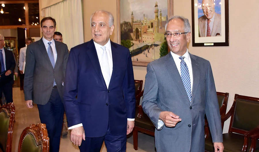 US envoy Zalmay Khalilzad, the US Special Representative for Afghanistan Reconciliation (left), is accompanied by Pakistan's Foreign Affairs Additional Secretary Aftab Khokhar as he arrives at the Foreign Ministry in Islamabad on June 2, 2019. (AFP)