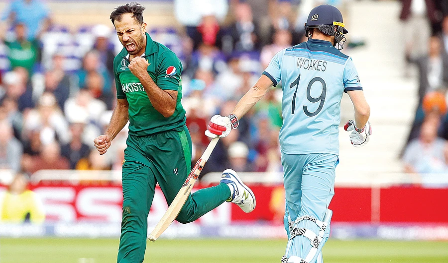 Pakistan's Wahab Riaz celebrates the wicket of England's Chris Woakes on Monday. (Reuters)