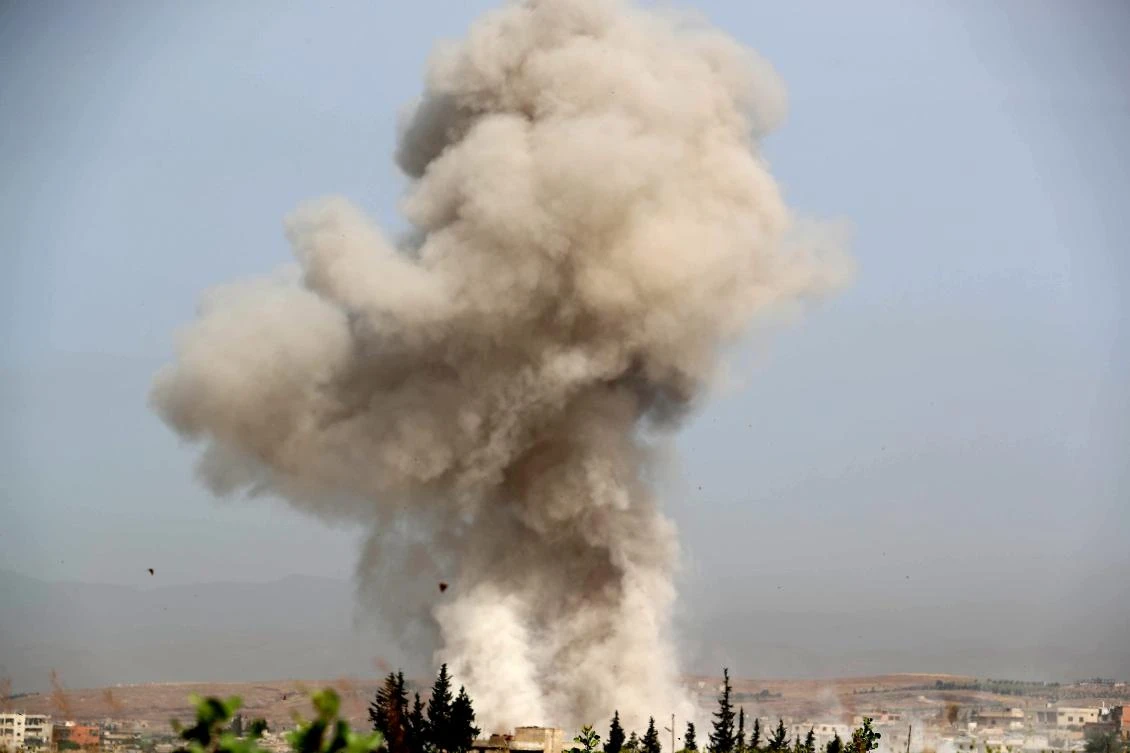 Smoke plumes billow following reported Syrian government forces' bombardment in the southern countryside of the largely militant-controlled region of Idlib on May 24, 2019. (AFP)