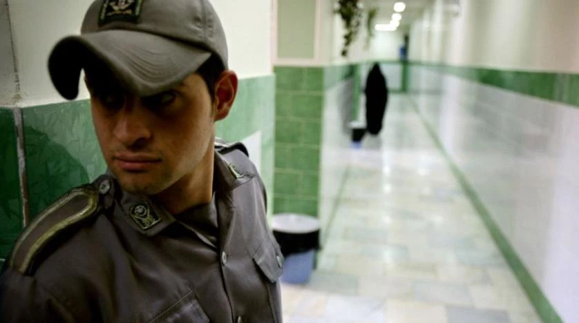 A prison guard stands along a corridor in Tehran’s Evin prison. (Reuters)