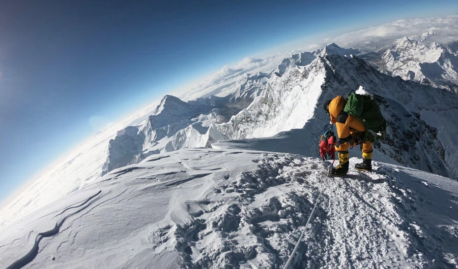 In this file photo taken on May 17, 2018, mountaineers make their way to the summit of Mount Everest, as they ascend on the south face from Nepal. (AFP / Phunjo Lama)