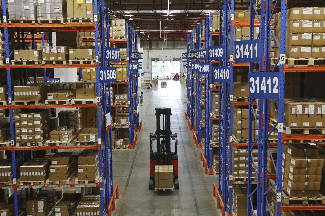 A forklift transfers goods at a logistic warehouse in Nanjing. China’s proposed list of ‘unreliable’ foreign companies is widely seen as a response to the blacklisting of Chinese companies by the US. (AP Photo)