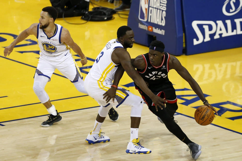 Pascal Siakam of the Toronto Raptors is defended by Draymond Green of the Golden State Warriors in the second half during Game Three of the 2019 NBA Finals at ORACLE Arena on June 05, 2019 in Oakland, California. (Lachlan Cunningham/Getty Images/AFP)