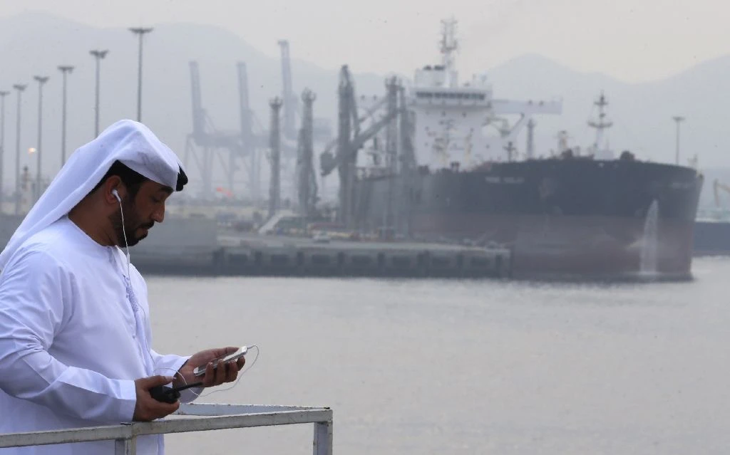 Trade tensions are reducing demand for oil just as global supply and demand are closer to balance. Above, Fujairah port in the UAE. (Reuters)