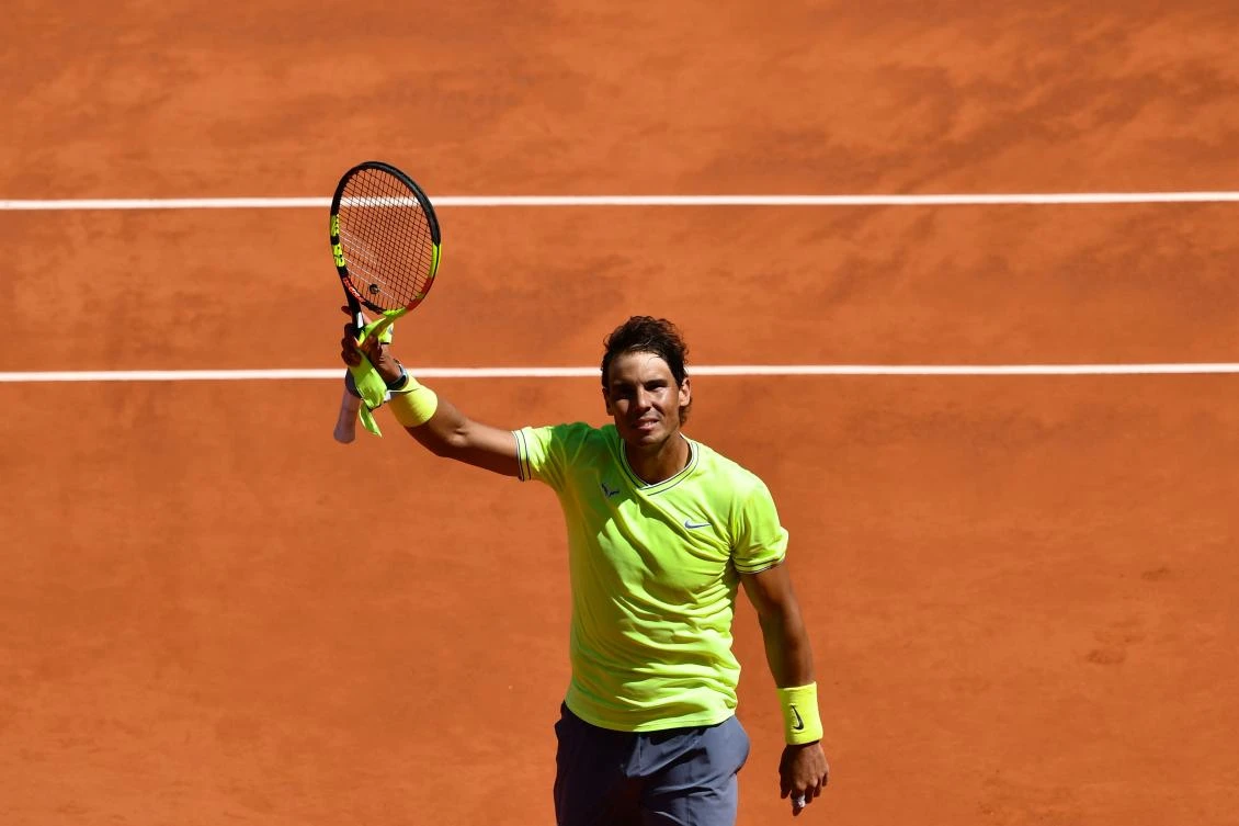 Spain's Rafael Nadal celebrates after winning against Switzerland's Roger Federer during their men's singles semi-final match. (AFP)