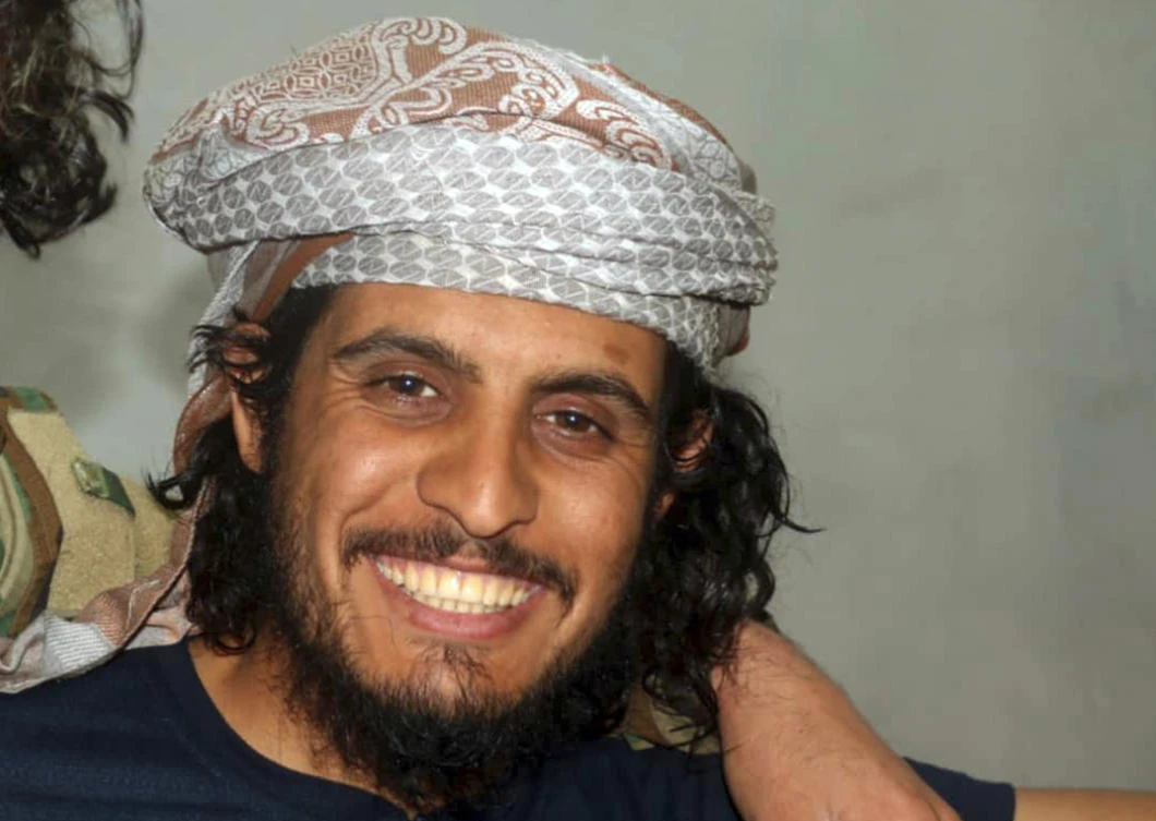 Abdelbaset Sarout, the former Syrian national goalkeeper turned anti-government fighter, smiles as he poses for a picture, in Hama, Syria. (AP)