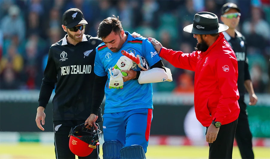 Cricket — ICC Cricket World Cup — Afghanistan v New Zealand — The County Ground, Taunton, Britain — June 8, 2019 New Zealand’s Kane Williamson helps Afghanistan’s Rashid Khan after he is bowled by New Zealand’s Lockie Ferguson (Action Images via Reuters)