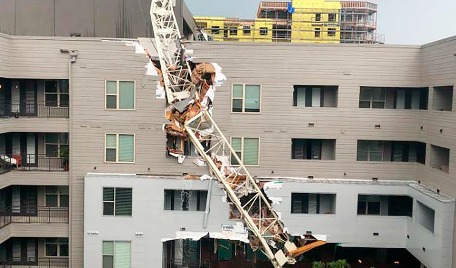 1 killed, 5 injured when crane topples on Dallas apartments