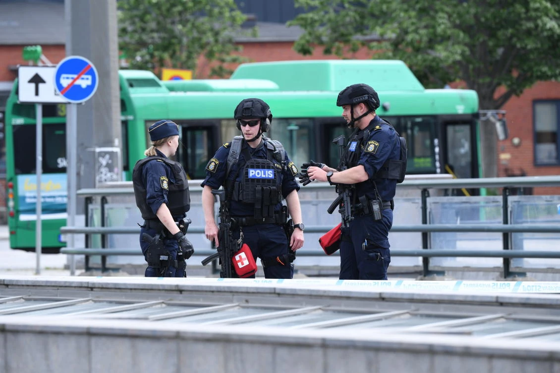 Police offices attend the scene after police shot and wounded a man at Malmo central station, Sweden, Monday June 10, 2019. (AP)
