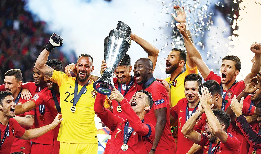 Portugal's forward Cristiano Ronaldo celebrates with teammates after the UEFA Nations League final football match against the Netherlands. (AFP)