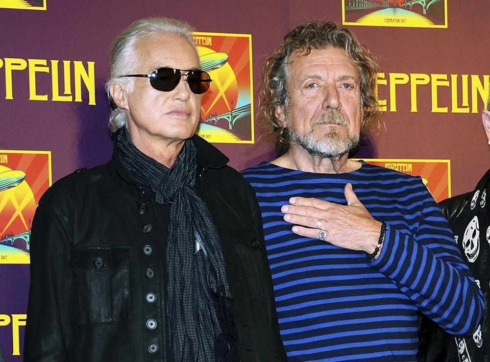In this Oct. 9, 2012 file photo, Led Zeppelin guitarist Jimmy Page, left, and singer Robert Plant appear at a news conference ahead of the worldwide theatrical release of "Celebration Day," a concert film of their 2007 London O2 arena reunion show, in New York. (Photo by Evan Agostini/Invision/AP, File)