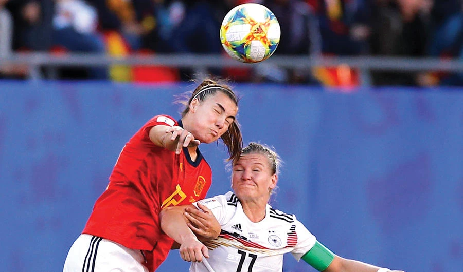 Spain’s Patri Guijarro, left, in action with Germany’s Alexandra Popp. (Reuters)