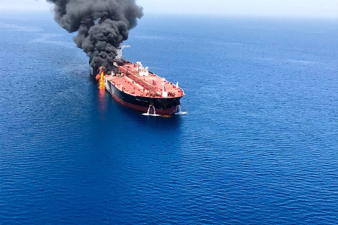 Above, fire aboard the oil tanker Front Altair in the Gulf of Oman after a reported attack. (Reuters)