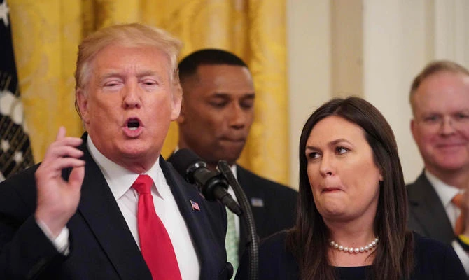 US President Donald Trump announcing the departure of White House Press Secretary Sarah Huckabee Sanders on June 13, 2019. Trump is being criticized for saying he would be willing to accept damaging information about political opponents from foreign sources as he seeks re-election. (AFP / MANDEL NGAN)