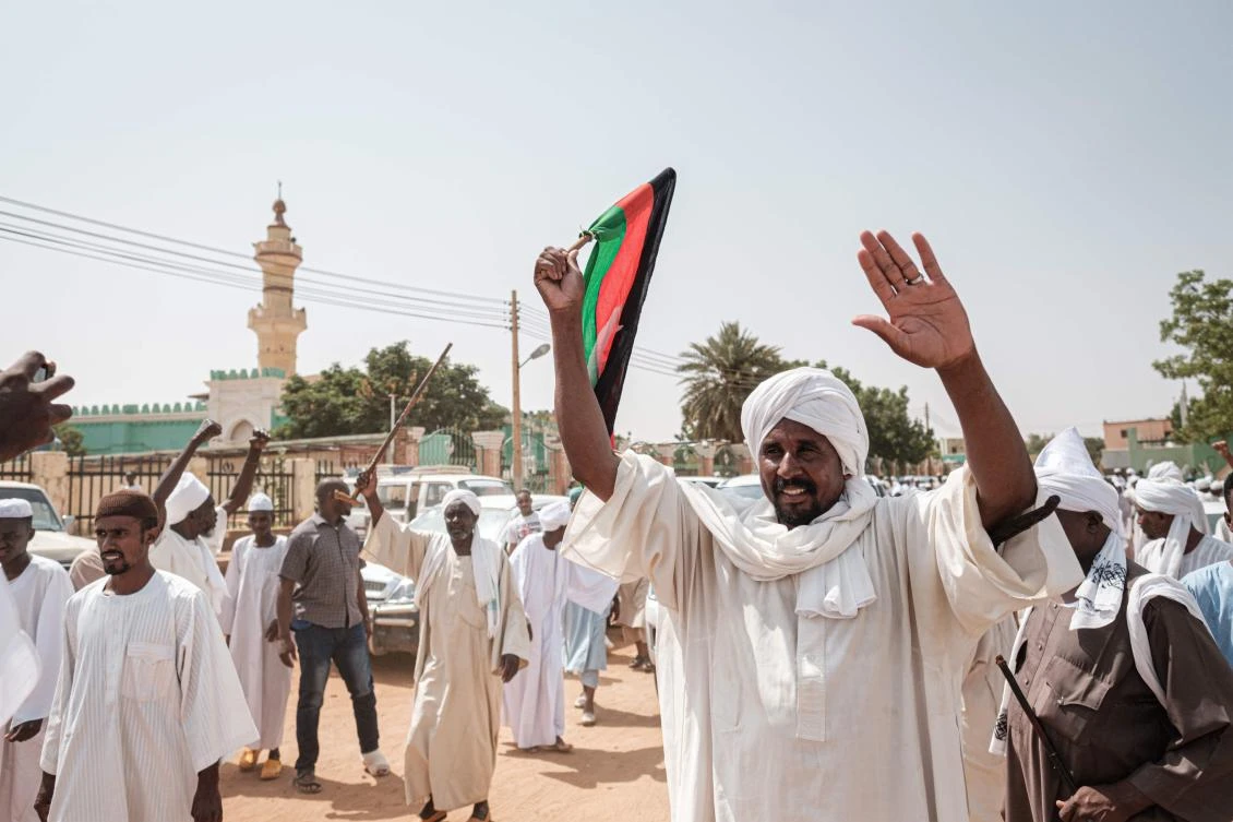 People react as they leave a mosque where Sudanese top opposition leader and former premier attended Friday prayers in the capital Khartoum's twin city Omdurman on June 14, 2019. (AFP)